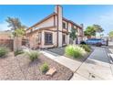 Charming townhome with a well-manicured front yard and driveway at 110 Huckleberry Ln, Henderson, NV 89074
