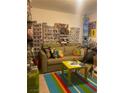 Eclectic living room with colorful decor and a cozy sofa, perfect for relaxing at 123 Gilliflower Ave, Las Vegas, NV 89183