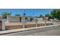 Welcoming single-story home with a secure fence, desert landscape, and a neatly kept front yard at 1816 Silver Birch Ln, Las Vegas, NV 89104