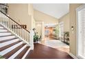 Spacious foyer with staircase, tile floors and stylish decor at 2021 Summit Pointe Dr, Las Vegas, NV 89117