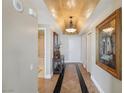 Elegant hallway with decorative ceiling, tiled floors, console table, and art, providing a stylish entrance at 222 Karen Ave # 3208, Las Vegas, NV 89109