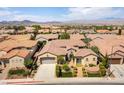 Expansive aerial view showcasing the home, its well-manicured landscaping, and the surrounding residential neighborhood at 2373 Ozark Plateau Dr, Henderson, NV 89044