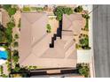 Bird's eye view of the property featuring a Spanish tile roof and the backyard with a swimming pool at 2373 Ozark Plateau Dr, Henderson, NV 89044