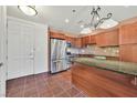 Kitchen with stainless steel appliances, a central island and granite countertop at 2455 W Serene Ave # 851, Las Vegas, NV 89123