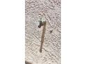 Outdoor faucet on a stucco wall, providing easy access for watering and maintenance at 2780 Avenue Of The Stars, Pahrump, NV 89060