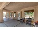 Welcoming covered front porch with comfortable seating and views of the natural surroundings at 2780 Avenue Of The Stars, Pahrump, NV 89060