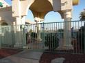 Community pool with an arched entrance and fenced perimeter viewable from outside at 3550 Bay Sands Dr # 2053, Laughlin, NV 89029