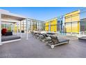 A sun-drenched rooftop pool deck features modern lounge chairs, pergolas and expansive city views at 3722 Las Vegas Blvd # 603, Las Vegas, NV 89158