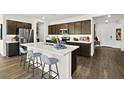 A kitchen featuring a spacious island, stainless steel appliances, and dark wood cabinets at 4350 E Brusca Way, Pahrump, NV 89061