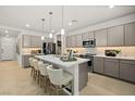 Beautiful kitchen with a large island, stainless steel appliances, and pendant lighting at 4365 E Brusca Way, Pahrump, NV 89061