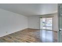 Spacious living room area with a sliding glass door to a balcony at 5240 Indian River Dr # 273, Las Vegas, NV 89103