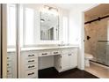 Well-lit bathroom with a spacious vanity, sleek fixtures, and a modern shower at 6330 Spring Meadow Dr, Las Vegas, NV 89103