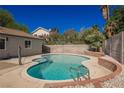 Beautiful pool and landscaped backyard perfect for outdoor relaxation and entertainment at 6330 Spring Meadow Dr, Las Vegas, NV 89103