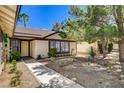 Charming front yard with a walkway leading to the front door of this cozy home at 6521 Faith Peak Dr, Las Vegas, NV 89108