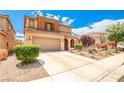 Inviting two-story home with a well-maintained front yard and attached two-car garage at 9271 Martel Ave, Las Vegas, NV 89148