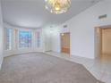Inviting living room with carpet, large windows, and neutral paint at 1424 Heartstring Ct, Henderson, NV 89002