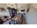 Elegant dining room featuring a chandelier, display cabinet, and seating for six at 1745 Walingwood Dr, North Las Vegas, NV 89031