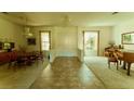 Bright and spacious living room with stylish tile flooring and neutral color palette at 2386 Hardin Ridge Dr, Henderson, NV 89052