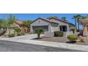Inviting single-story home boasts a well-maintained front yard and a convenient two-car garage at 2512 Libretto Ave, Henderson, NV 89052