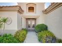 Inviting front entrance with wrought iron gate and lush landscaping at 2801 Byron Dr, Las Vegas, NV 89134