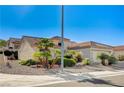 Single-story house with desert landscaping and a two-car garage at 2801 Byron Dr, Las Vegas, NV 89134