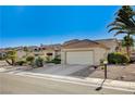 Charming single-story house featuring desert landscaping and a two-car garage at 2801 Byron Dr, Las Vegas, NV 89134