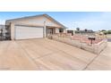 Exterior shot of single story house with a concrete driveway at 4386 El Cebra Way, Las Vegas, NV 89121