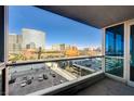 Balcony showcases expansive city views and modern architecture under clear blue skies at 4525 Dean Martin Dr # 909, Las Vegas, NV 89103