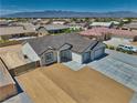 A bird's eye view of a well-maintained single-story house with mountain views in the background at 4861 Ridgewood, Pahrump, NV 89061