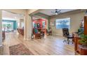 Open-concept living area featuring hardwood floors and an abundance of natural light at 489 Open Hill Ave, Henderson, NV 89011