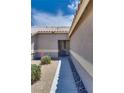 Inviting front yard with desert landscaping and a walkway leading to the entrance at 5116 Blue Onion Cir, North Las Vegas, NV 89031