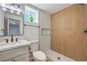 Stylish bathroom featuring modern fixtures, a walk-in shower, and neutral-toned tiles at 5200 Blanton Dr, Las Vegas, NV 89122