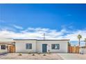 Charming single-story home with a minimalist landscape and bright blue front door at 5200 Blanton Dr, Las Vegas, NV 89122