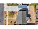 Aerial view of a single-story home with a xeriscaped front yard, covered parking, and gray roof at 524 Hopi Pl, Boulder City, NV 89005