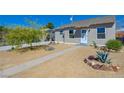 Charming single-story home featuring a xeriscaped front yard and walkway at 524 Hopi Pl, Boulder City, NV 89005