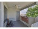 Cozy balcony featuring a ceiling fan, seating, and views of the surrounding area at 6804 Elm Creek Dr # 202, Las Vegas, NV 89108