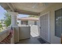 Balcony view with tiled floor, security door, and sturdy white columns at 6804 Elm Creek Dr # 202, Las Vegas, NV 89108