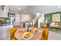 View of the kitchen and living space, showcasing modern design and luxury vinyl plank flooring at 7351 Kyle Cove Dr # Lot 208, North Las Vegas, NV 89084