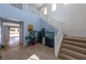 Open foyer featuring a staircase, tile flooring, an aquarium and plenty of natural light at 754 Tallgrass St, Las Vegas, NV 89138
