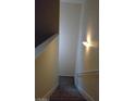 Carpeted stairway with white walls and a handrail, leading to the upper level of the home at 7701 W Robindale Rd # 259, Las Vegas, NV 89113