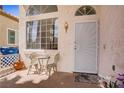 Inviting front entrance with security door and charming seating area perfect for enjoying a morning coffee at 8116 Kokoma Dr, Las Vegas, NV 89128