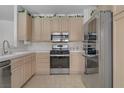 Well-equipped kitchen featuring stainless steel appliances and ample cabinet space, designed for convenience and style at 8116 Kokoma Dr, Las Vegas, NV 89128