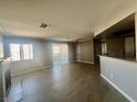 Bright living room with wood floors, sliding doors, and a view of the fireplace at 8600 W Charleston Blvd # 2033, Las Vegas, NV 89117