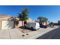 Charming single-story home showcasing a well-maintained exterior with a private one-car garage and desert landscaping at 864 Chianti Way, Mesquite, NV 89027