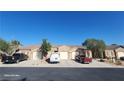 Charming single-story home showcasing a well-maintained exterior with a private two-car garage and desert landscaping at 864 Chianti Way, Mesquite, NV 89027
