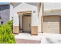 Close up of front entrance and tan colored front door of this two-story home at 11134 Casala Ct, Las Vegas, NV 89141