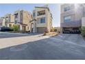 Modern home with a two-car garage, desert landscaping, and ample driveway parking at 2151 Noble Perch St, Las Vegas, NV 89138
