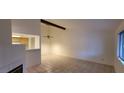 Spacious living room with tile floors, fan, and fireplace at 2216 Short Pine Dr, Las Vegas, NV 89108