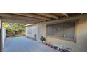 The side yard features a covered patio and plenty of space to enjoy the outdoors at 2216 Short Pine Dr, Las Vegas, NV 89108