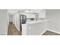 Modern kitchen with stainless steel appliances and white cabinets and countertops at 2480 Old Forge Ln # 74, Las Vegas, NV 89121